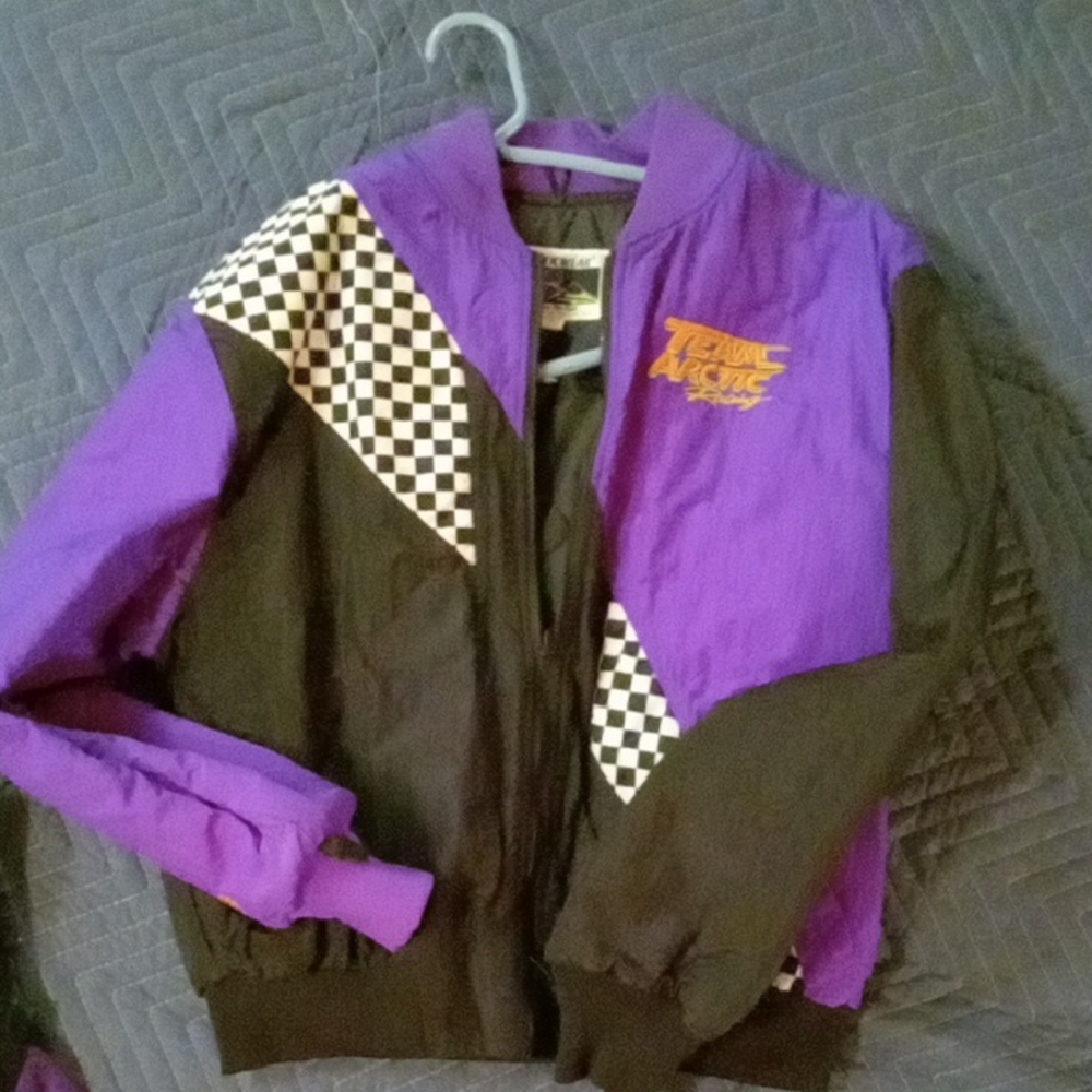 Arctic cat inside shell and outside coat.